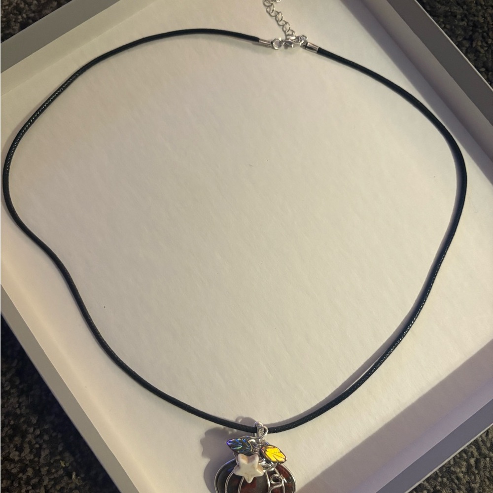 Necklace with a pumpkin pendant